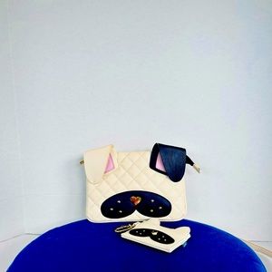 Gently used Betsy Johnson purse with wallet. Used once. Very cute puppy design